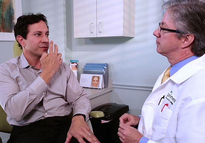 Dr. Gross consulting with a male patient