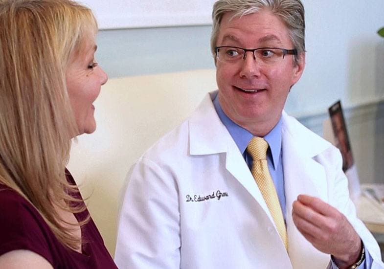 Dr. Gross consulting with a female patient