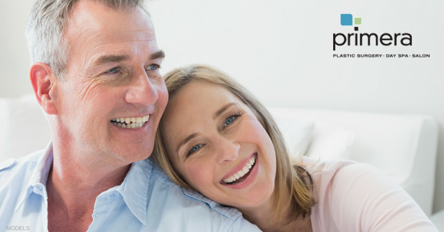 Happy middle aged couple with woman's head on resting on man's shoulder