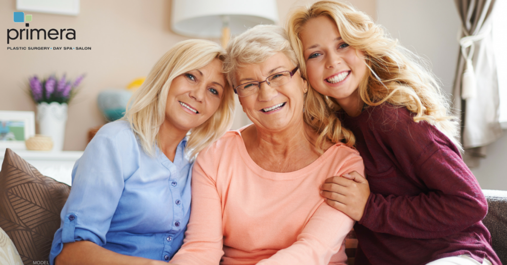 three generations of women smiling with beautiful skin