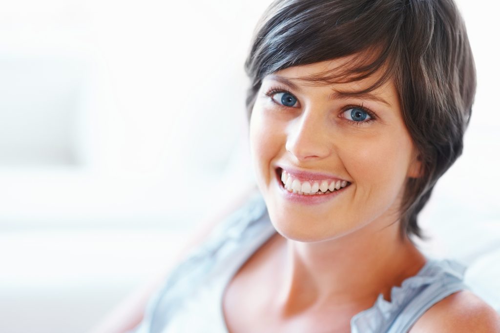 Smiling woman with alert, rested eyes