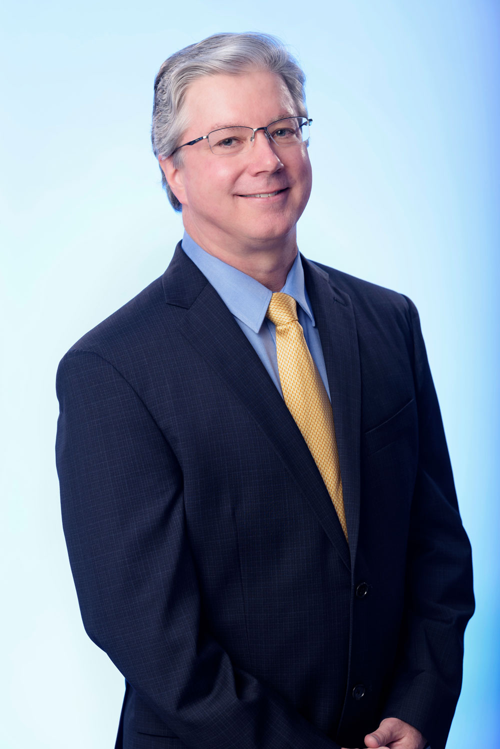 Dr. Edward J. Gross in suit and tie