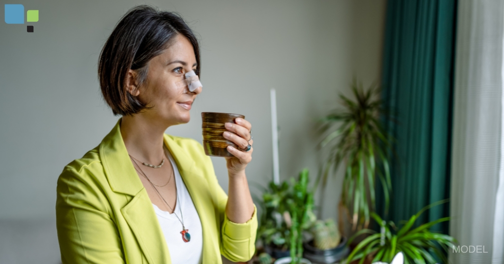 woman with bandaged nose holding a cup (model)