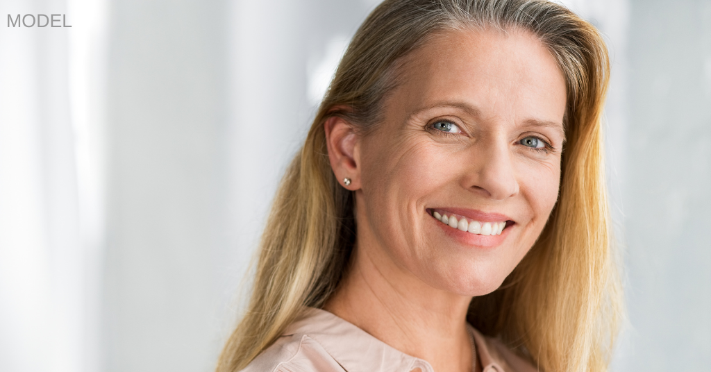 Woman with blonde hair smiling (model)