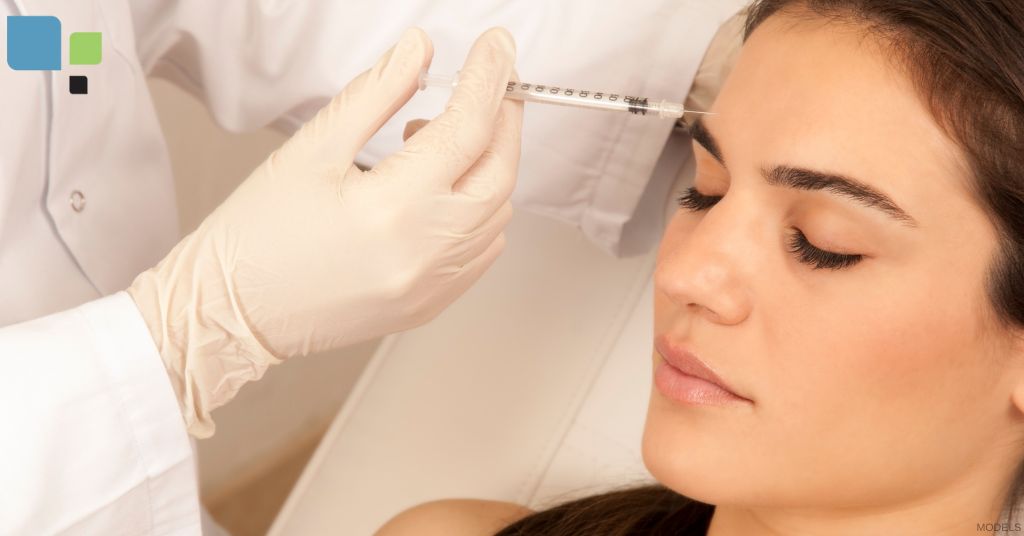 A woman getting an injection from a doctor. (Models)
